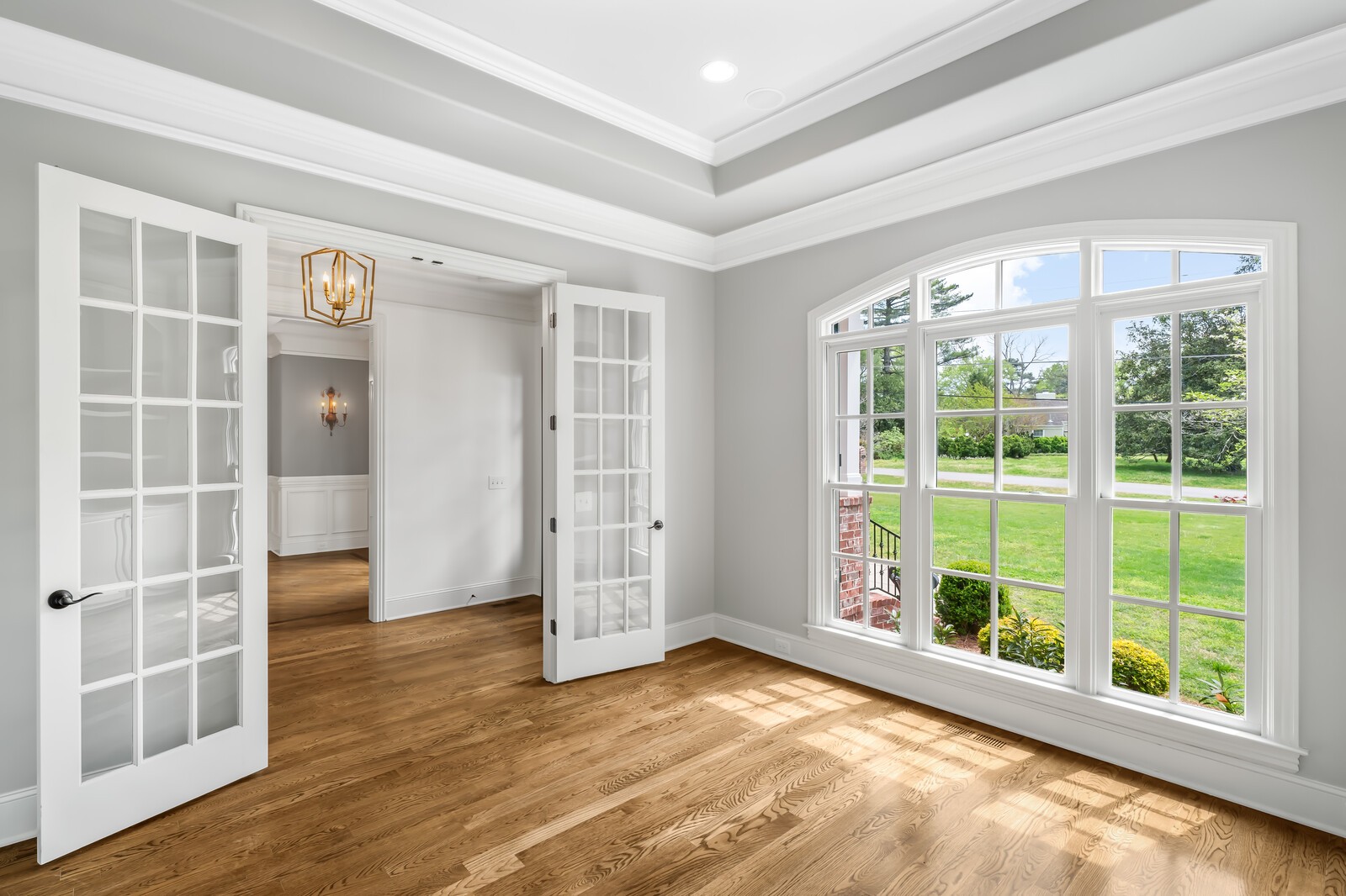 926 Evans Road Nashville, TN 37204 - Photo 11 of 53 a view of an empty room with wooden floor and windows