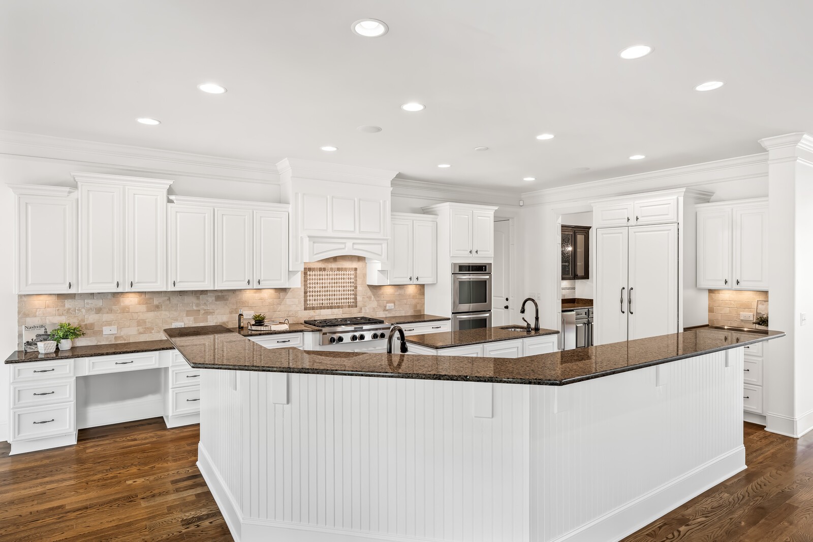 926 Evans Road Nashville, TN 37204 - Photo 17 of 53 a large kitchen with stainless steel appliances granite countertop a stove a sink a refrigerator and white cabinets