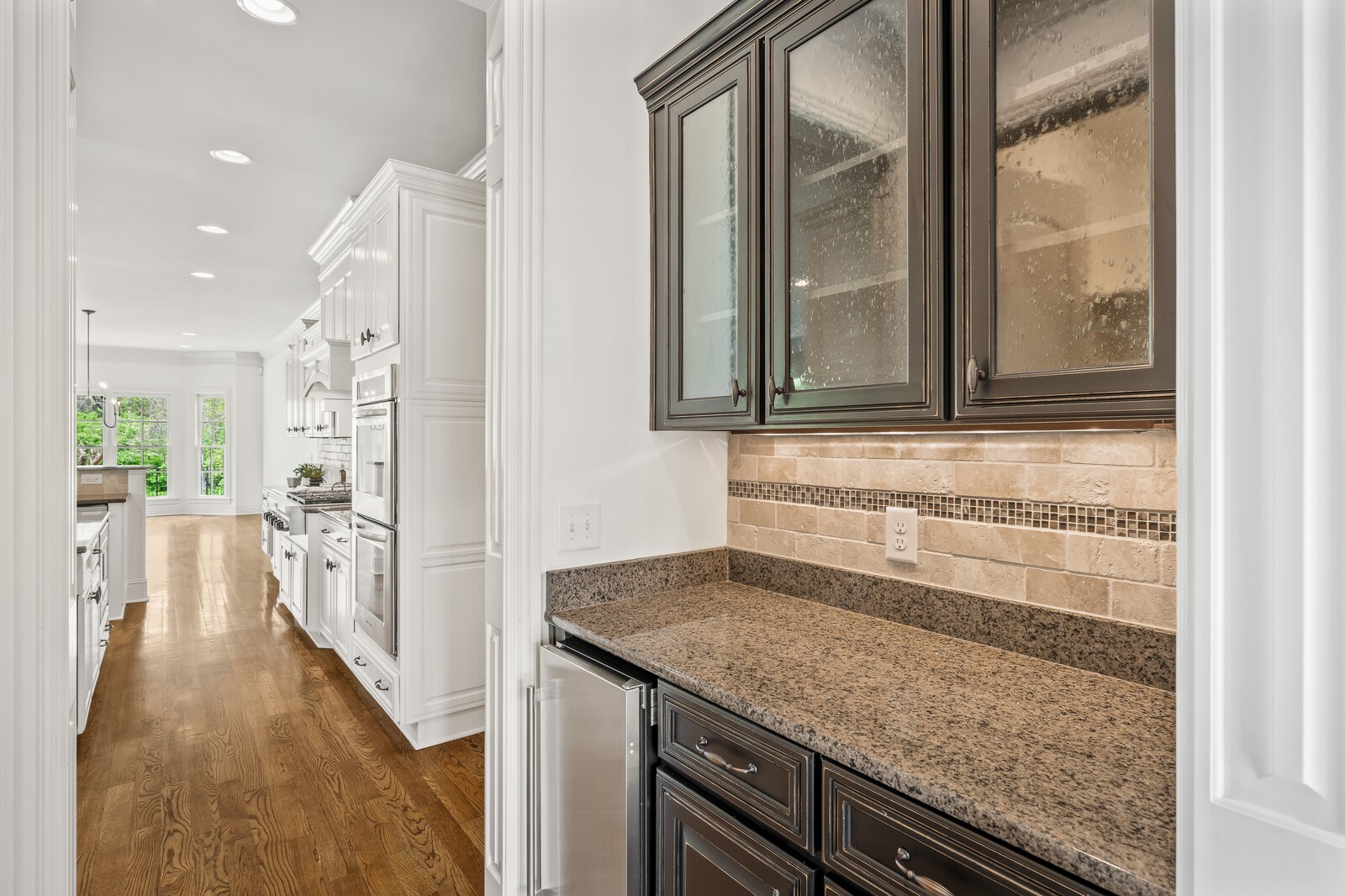 926 Evans Road Nashville, TN 37204 - Photo 18 of 53 a view of a kitchen cabinets and a wooden floor