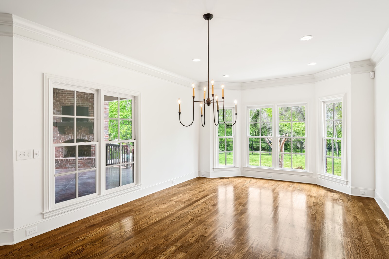 926 Evans Road Nashville, TN 37204 - Photo 19 of 53 a view of empty room with wooden floor and windows
