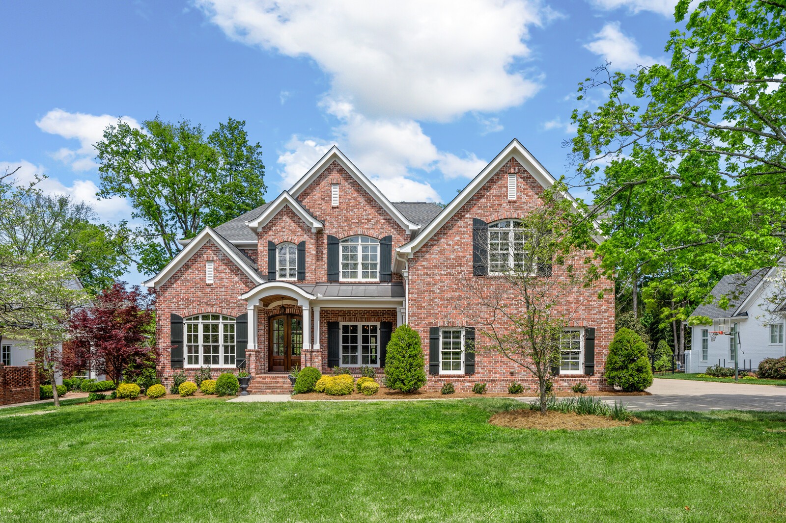 926 Evans Road Nashville, TN 37204 - Photo 2 of 53 a front view of a house with a garden and plants