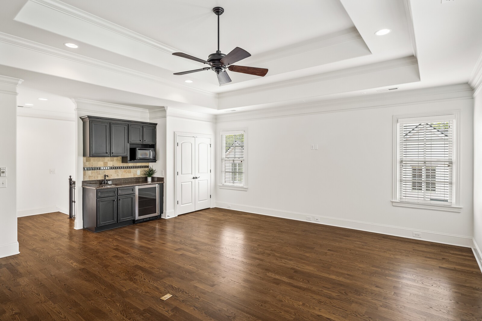 926 Evans Road Nashville, TN 37204 - Photo 30 of 53 a view of a kitchen with a stove wooden floor a ceiling fan and kitchen view
