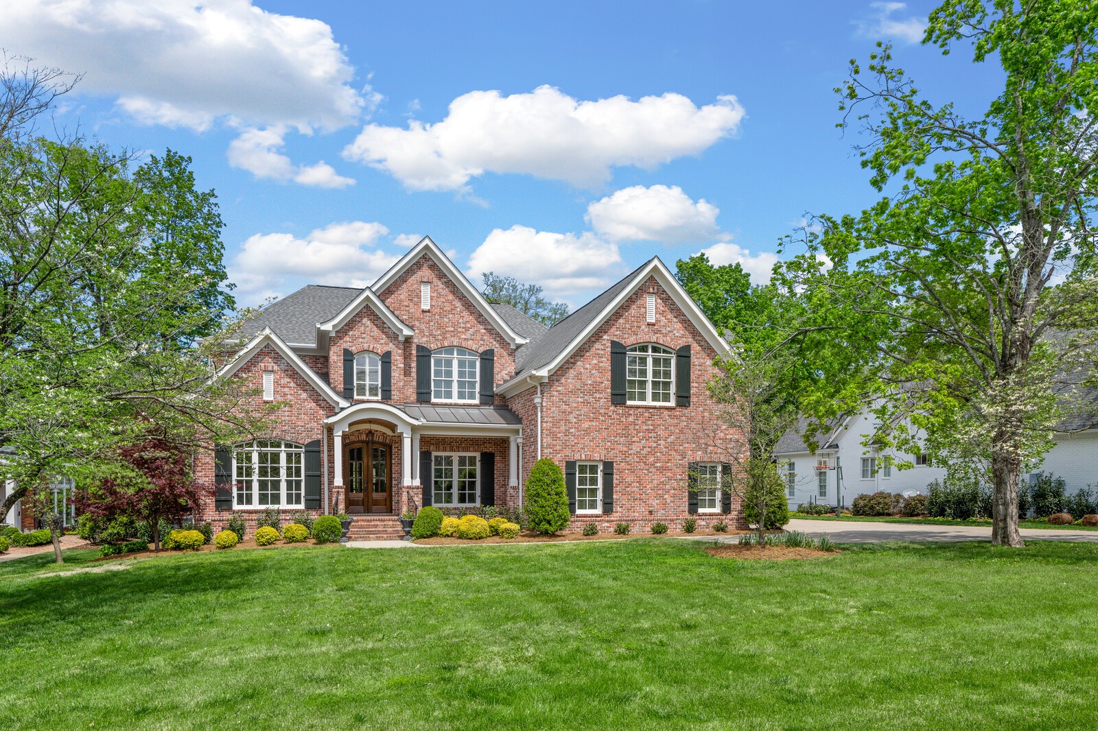 926 Evans Road Nashville, TN 37204 - Photo 3 of 53 a front view of a house with a garden