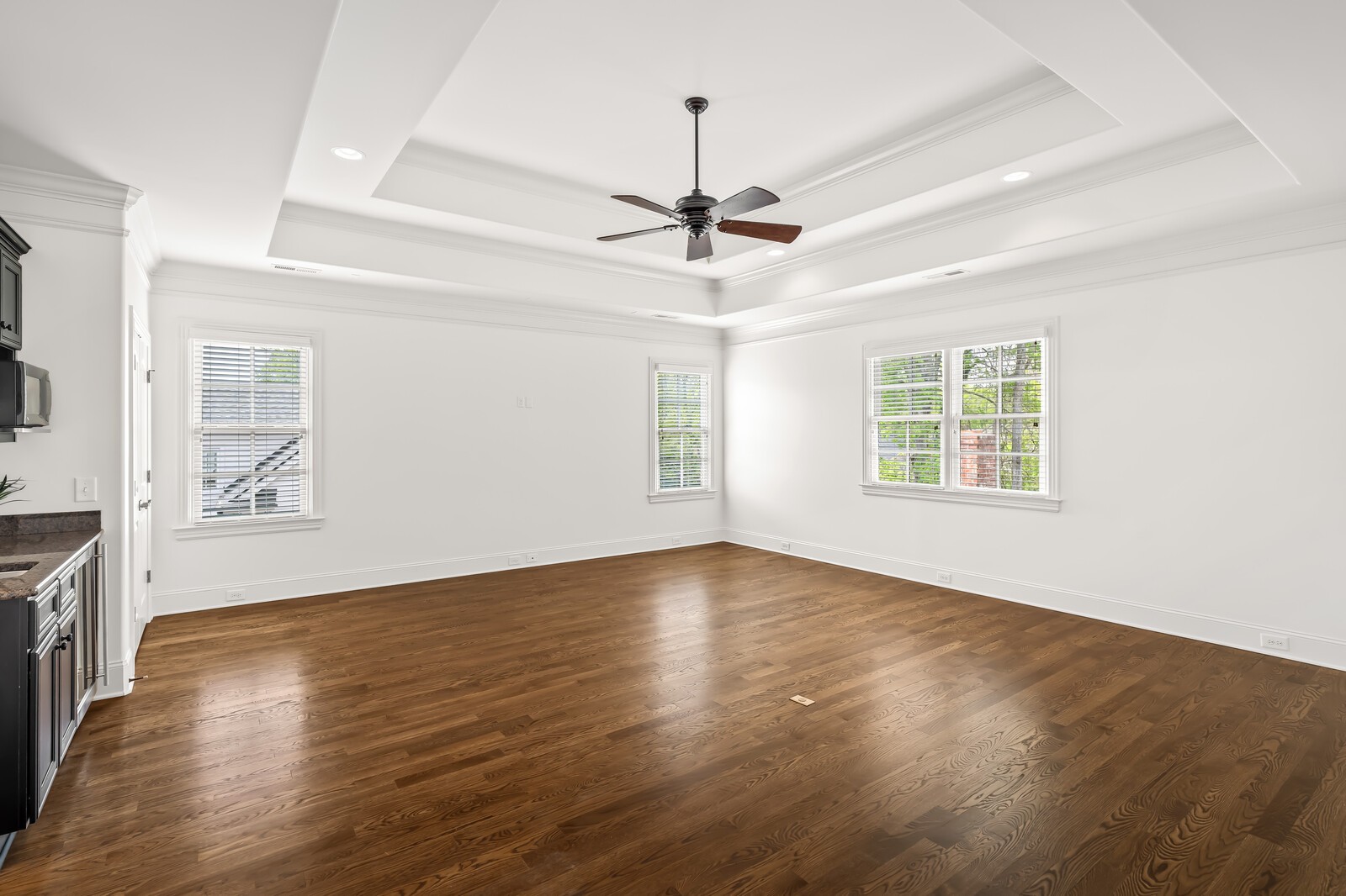926 Evans Road Nashville, TN 37204 - Photo 31 of 53 an empty room with wooden floor ceiling fan and windows