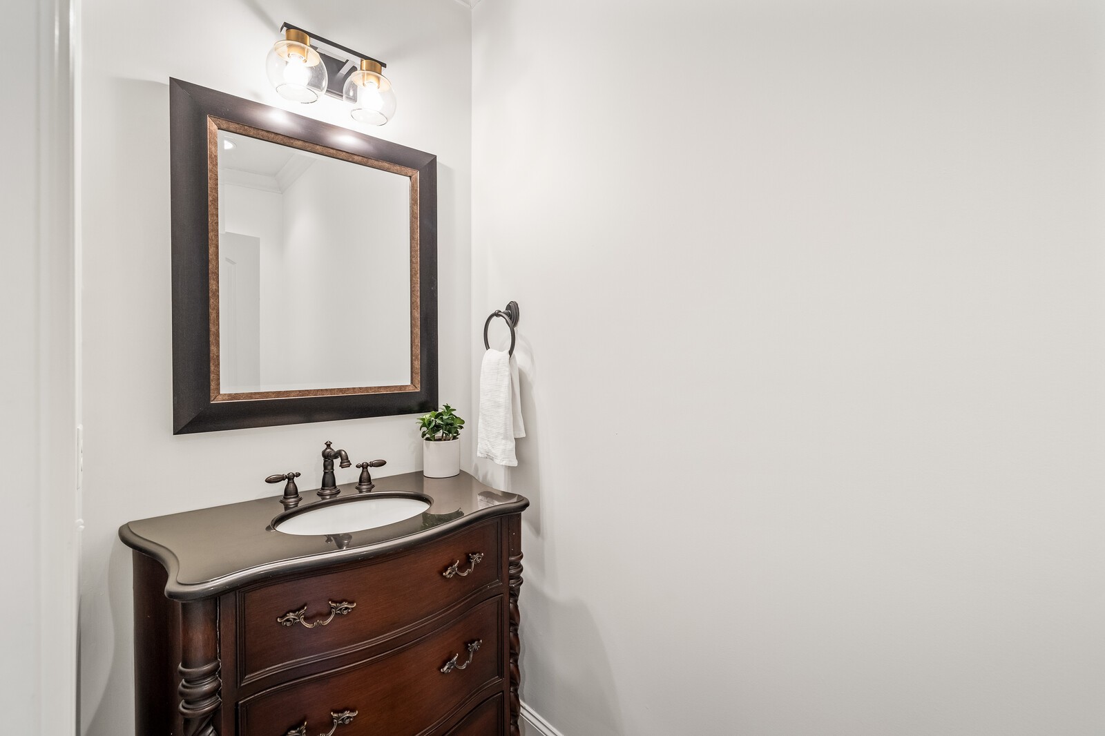 926 Evans Road Nashville, TN 37204 - Photo 34 of 53 a bathroom with a sink vanity and a mirror