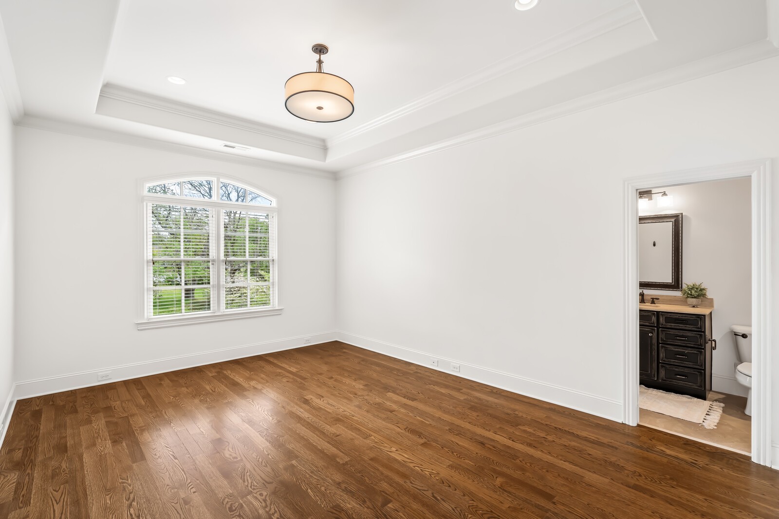 926 Evans Road Nashville, TN 37204 - Photo 38 of 53 an empty room with wooden floor and windows