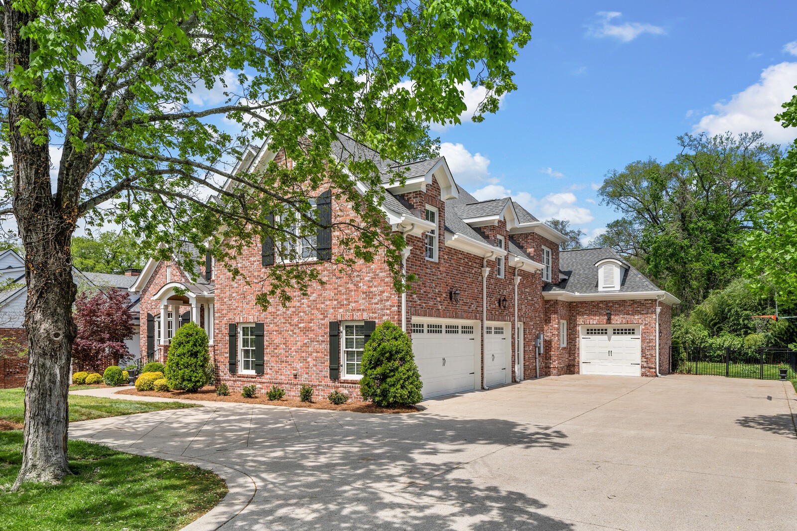 926 Evans Road Nashville, TN 37204 - Photo 5 of 53 a front view of a house with a yard and garage