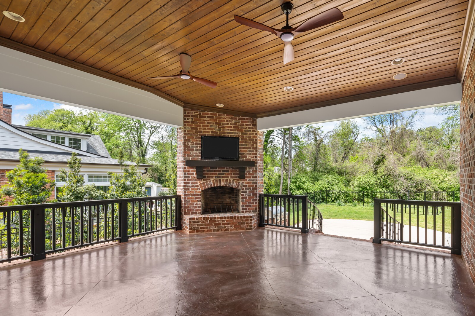 926 Evans Road Nashville, TN 37204 - Photo 51 of 53 a porch with a table and chairs next to a yard