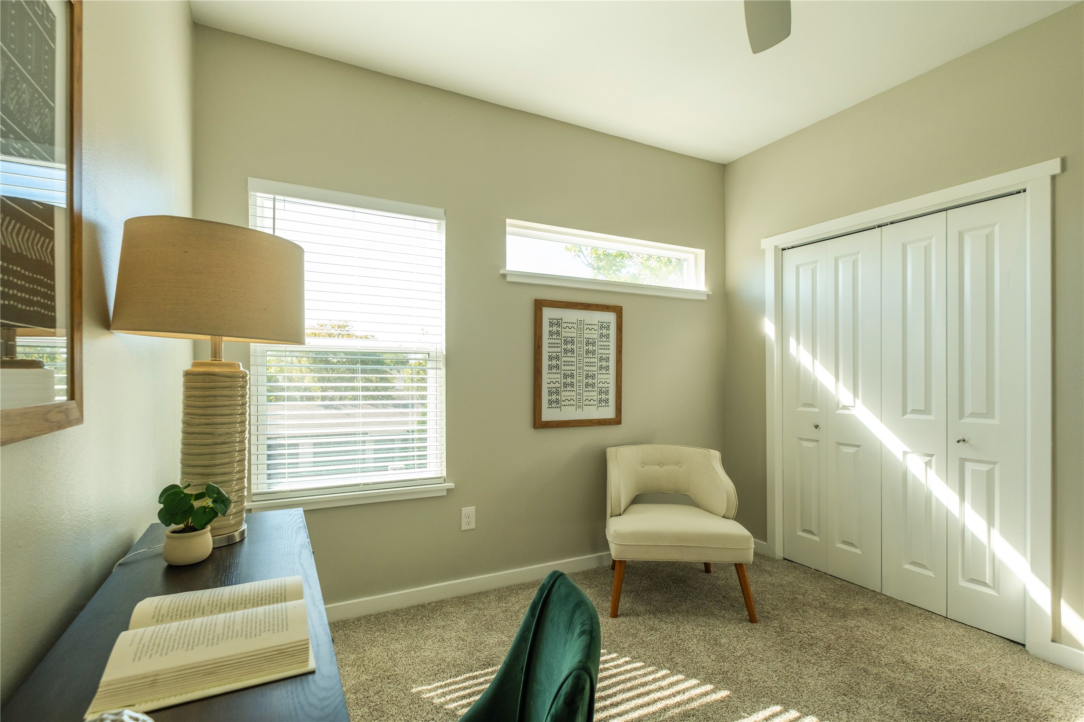 7601 Bethune Avenue, Unit B Austin, TX 78752 - Photo 22 of 39 Living area with carpet floors and a ceiling fan