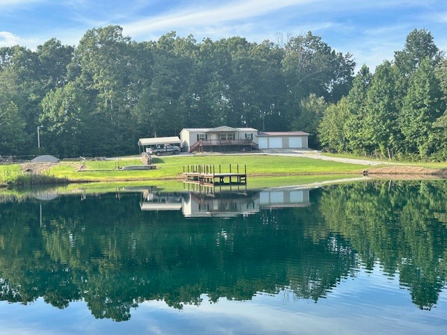 14021 Peachstone Road Crawford, TN 38554 - Photo 3 of 20 a view of a swimming pool with a yard and large trees