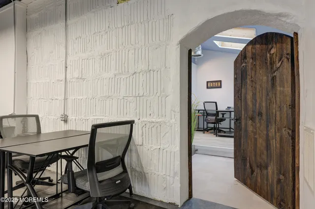 a view of a livingroom with furniture and front door