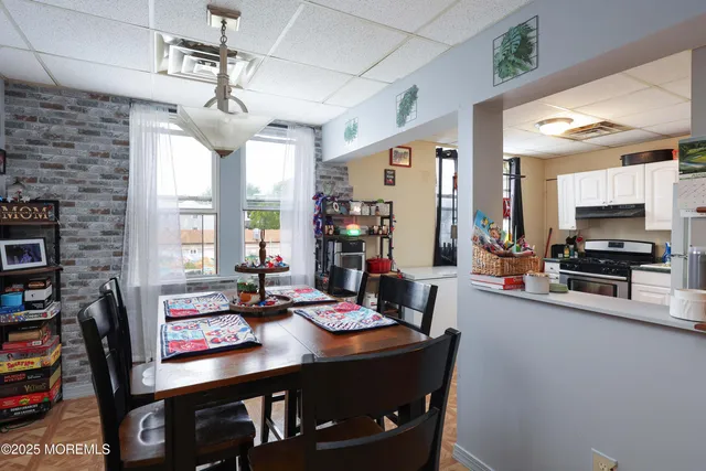 a kitchen with a dining table and chairs