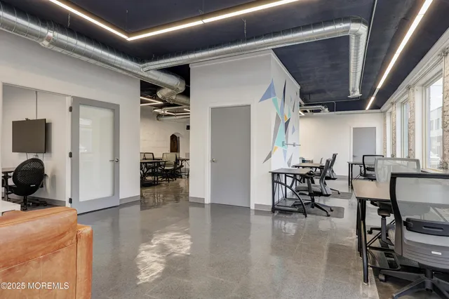a view of a livingroom with furniture and a livingroom