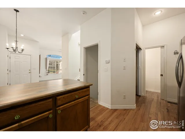 a view of a kitchen from a hallway