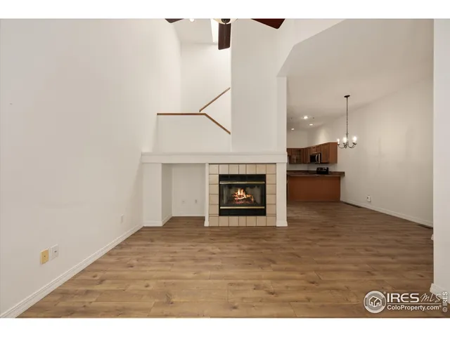 a view of an empty room and fire place