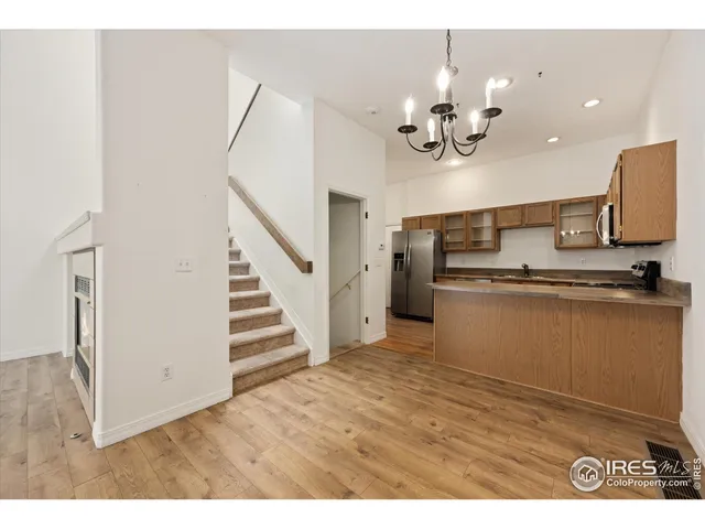 a view of a kitchen with a sink and dishwasher