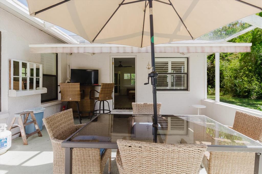 11521 Rose Tree Drive New Port Richey, FL 34654 - Photo 14 of 37 a view of living room kitchen with furniture and fireplace