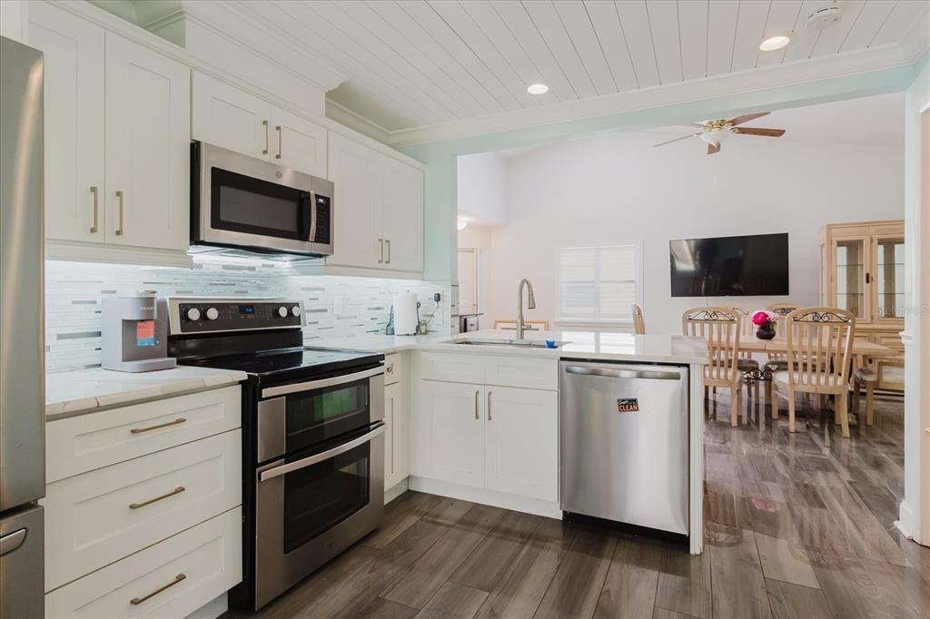 11521 Rose Tree Drive New Port Richey, FL 34654 - Photo 5 of 37 a kitchen with cabinets a sink and steel appliances