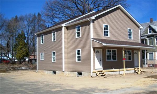 92-94 Chestnut Street Springfield, MA 01151 - Photo 8 of 24 a front view of a house with a garden