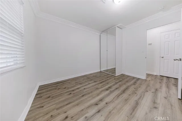 a view of room with wooden floor