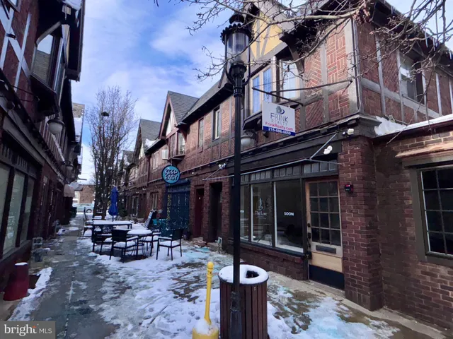 a view of a building with sitting area