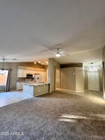 a view of a kitchen with a sink and cabinets