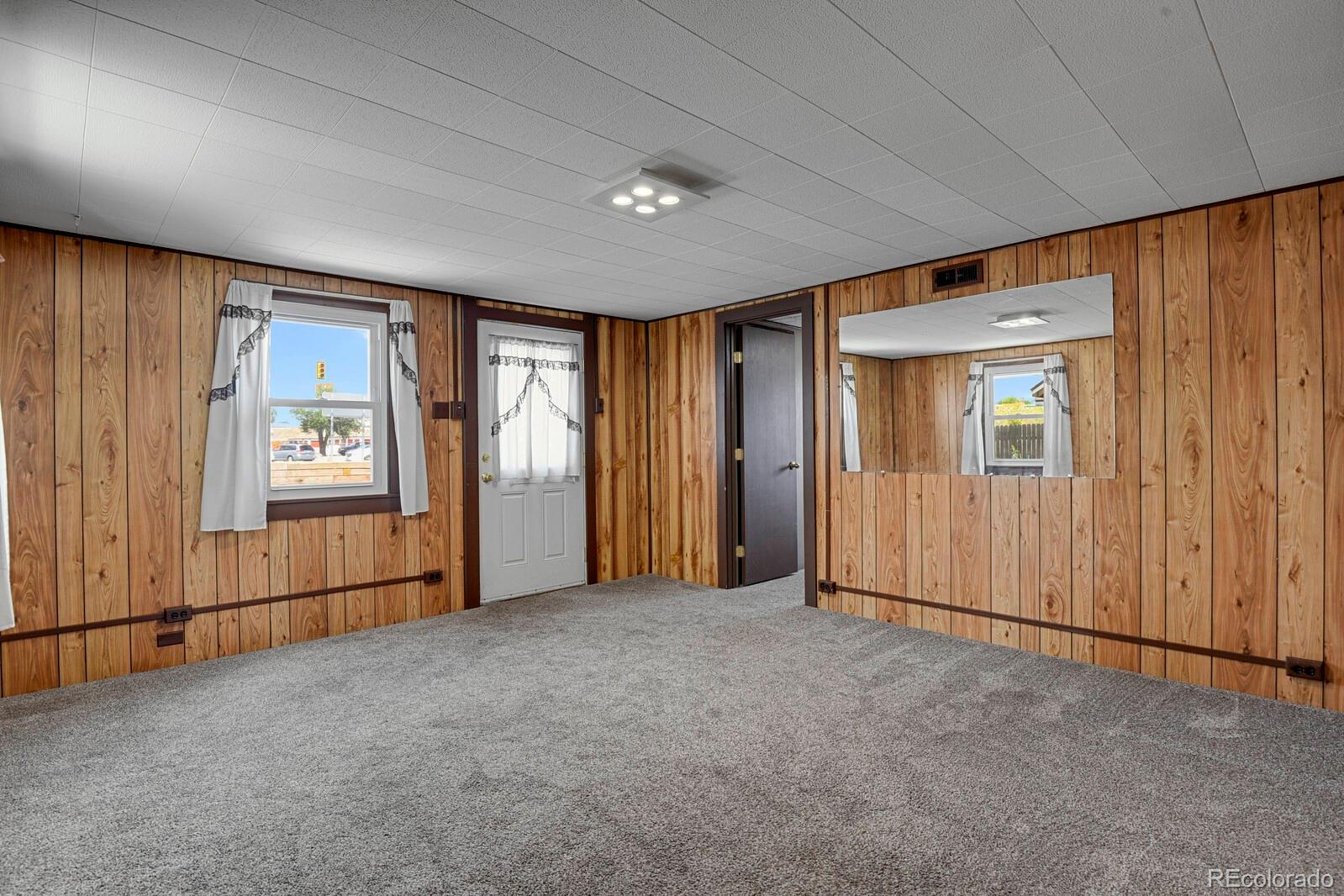 12400 West 44th Avenue Wheat Ridge, CO 80033 - Photo 5 of 31 an empty room with windows