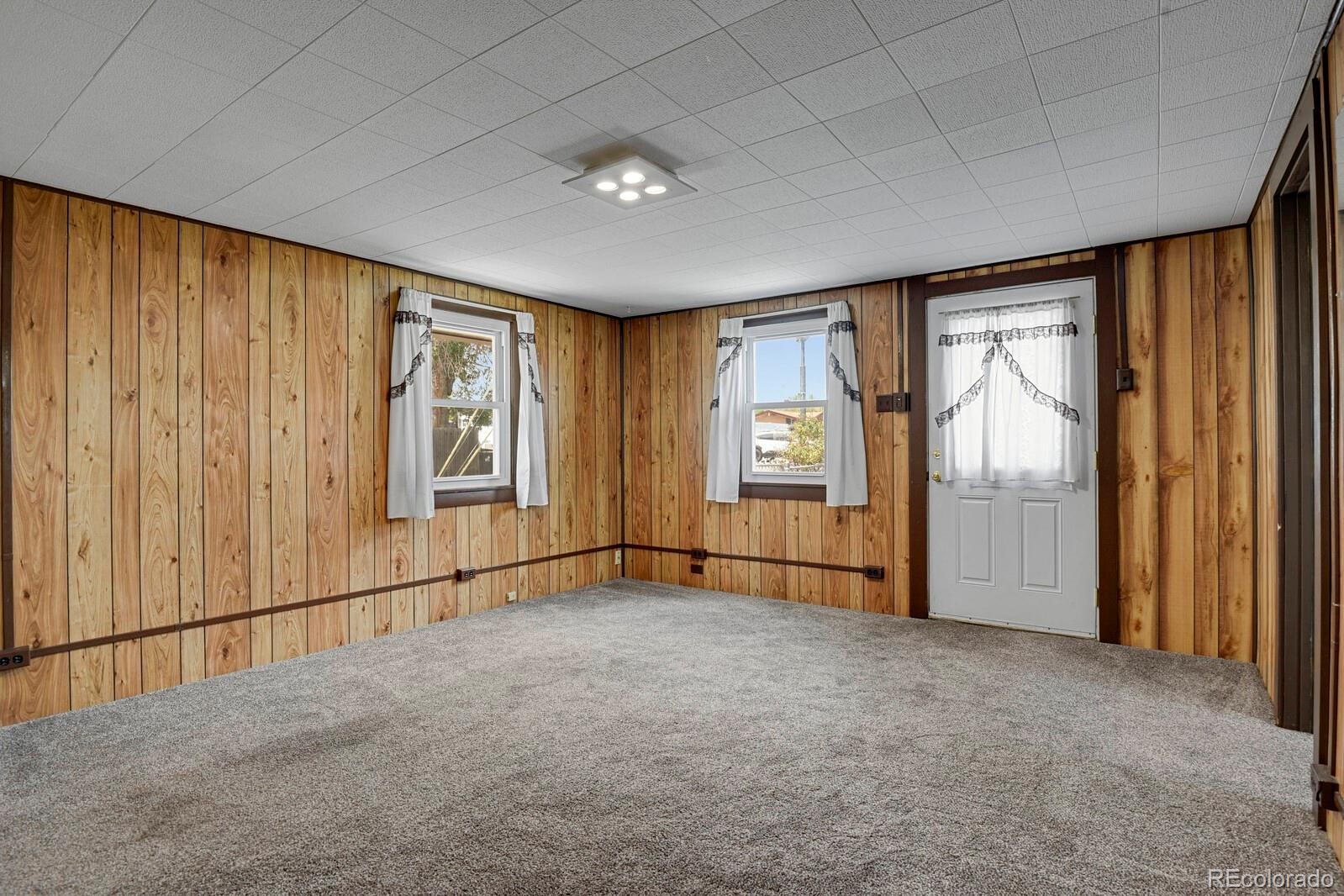 12400 West 44th Avenue Wheat Ridge, CO 80033 - Photo 6 of 31 an empty room with windows