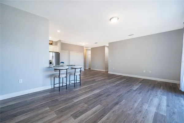 a view of a workspace with furniture and wooden floor