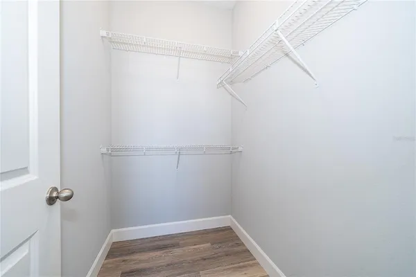 a view of a room with racks on the wall