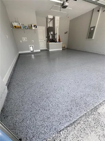 an aerial view of a house with a yard and garden