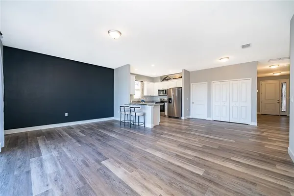 a view of a livingroom with wooden floor