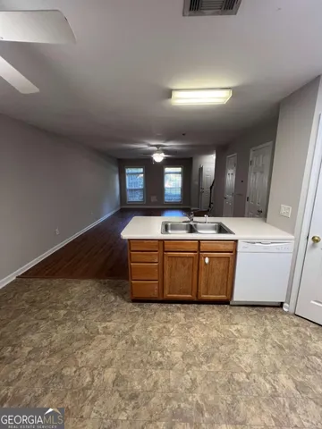 a spacious bathroom with a tub sink and mirror