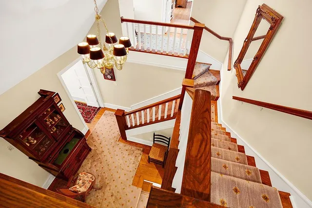 a view of an entryway and hall with wooden floor