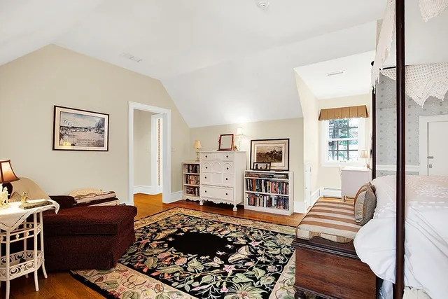 a bedroom with furniture and a window