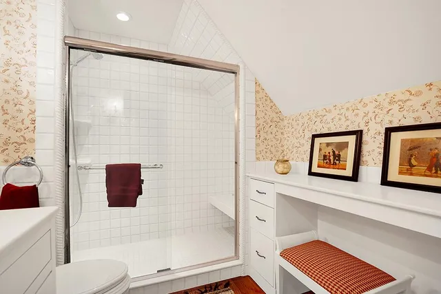 a bathroom with a shower and a toilet