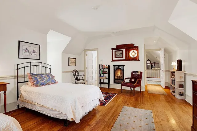 a bedroom with a bed and a table in it