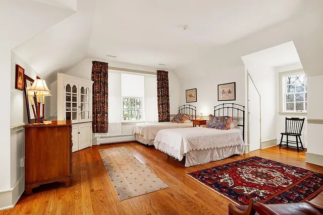 a bed room with bed and a window