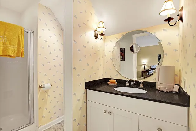 a bathroom with a sink and a mirror