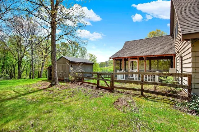 a view of house with outdoor seating area