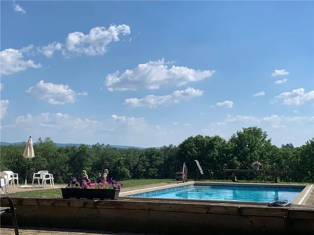 a view of a fountain in front of a house
