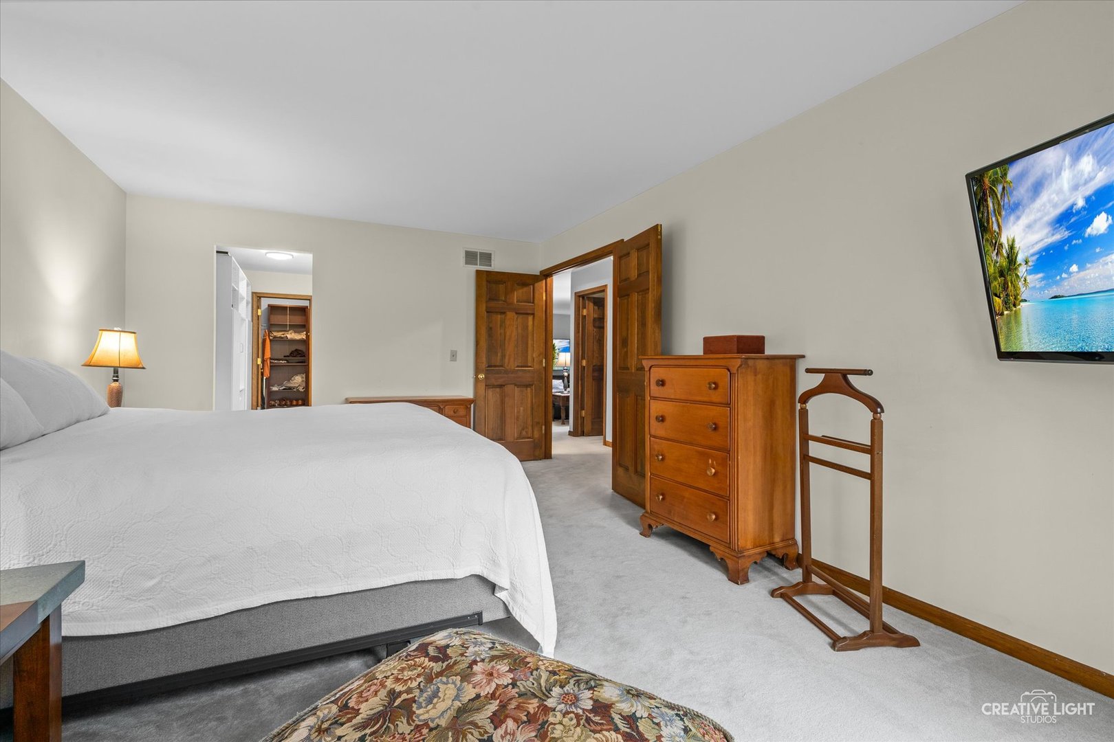 312 Dunham Place Commons, Unit 312 St. Charles, IL 60174 - Photo 13 of 28 a bedroom with bed and wooden floor
