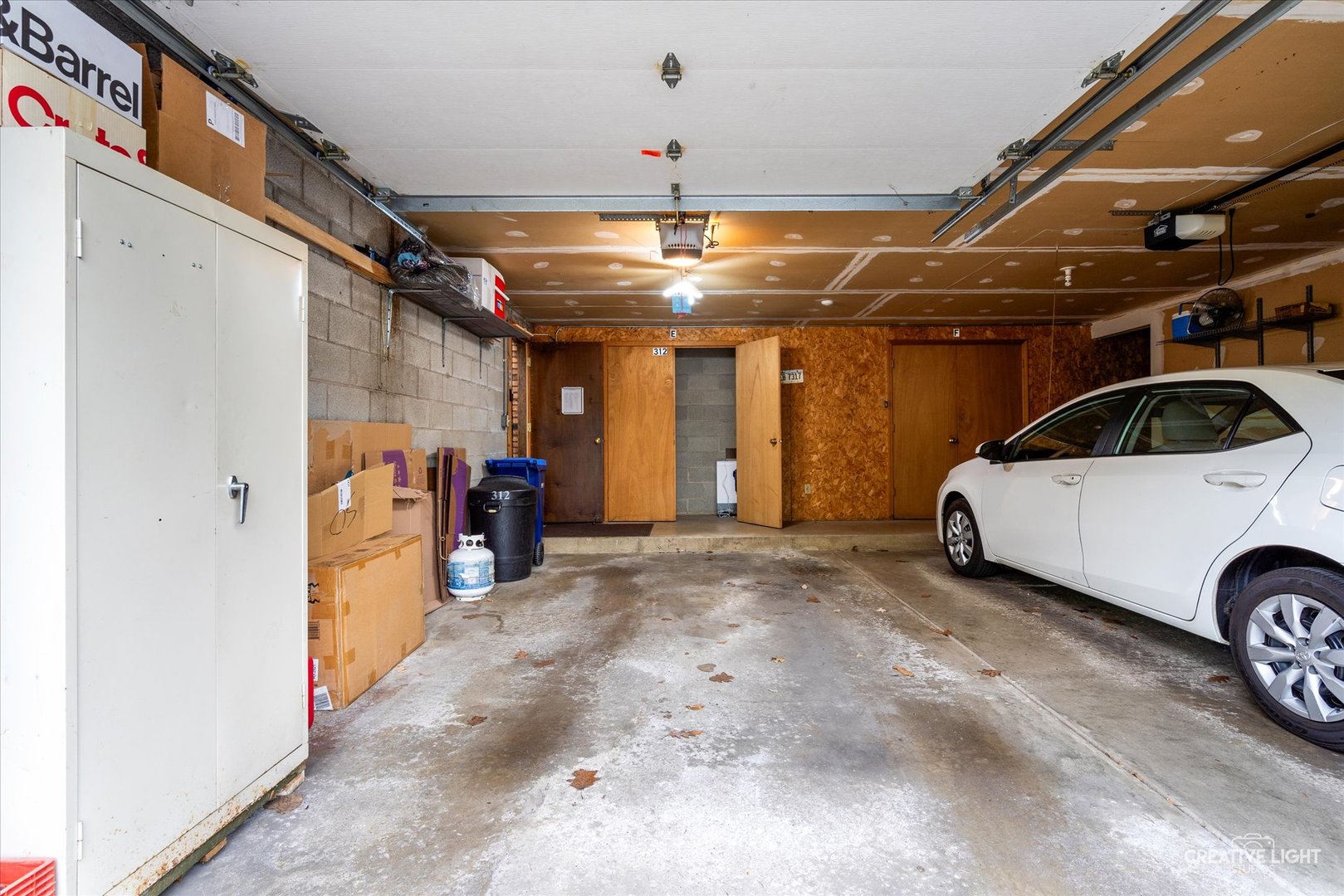 312 Dunham Place Commons, Unit 312 St. Charles, IL 60174 - Photo 22 of 28 a view of parking garage with cars