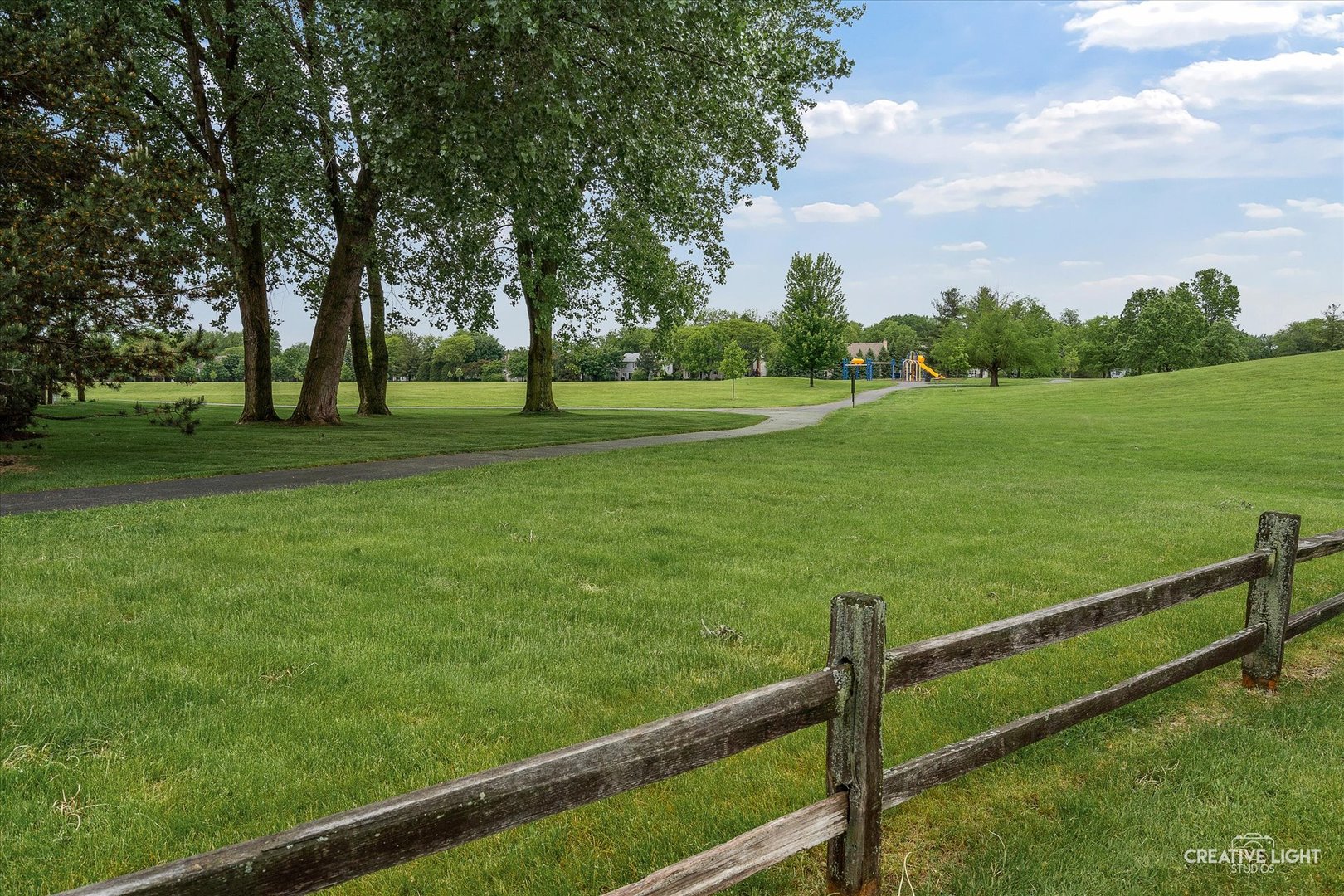 312 Dunham Place Commons, Unit 312 St. Charles, IL 60174 - Photo 23 of 28 a view of a field of grass and trees