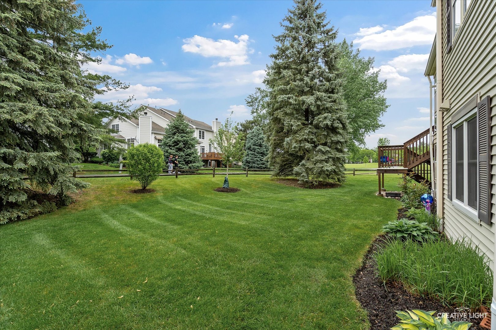 312 Dunham Place Commons, Unit 312 St. Charles, IL 60174 - Photo 24 of 28 a view of a park with large trees