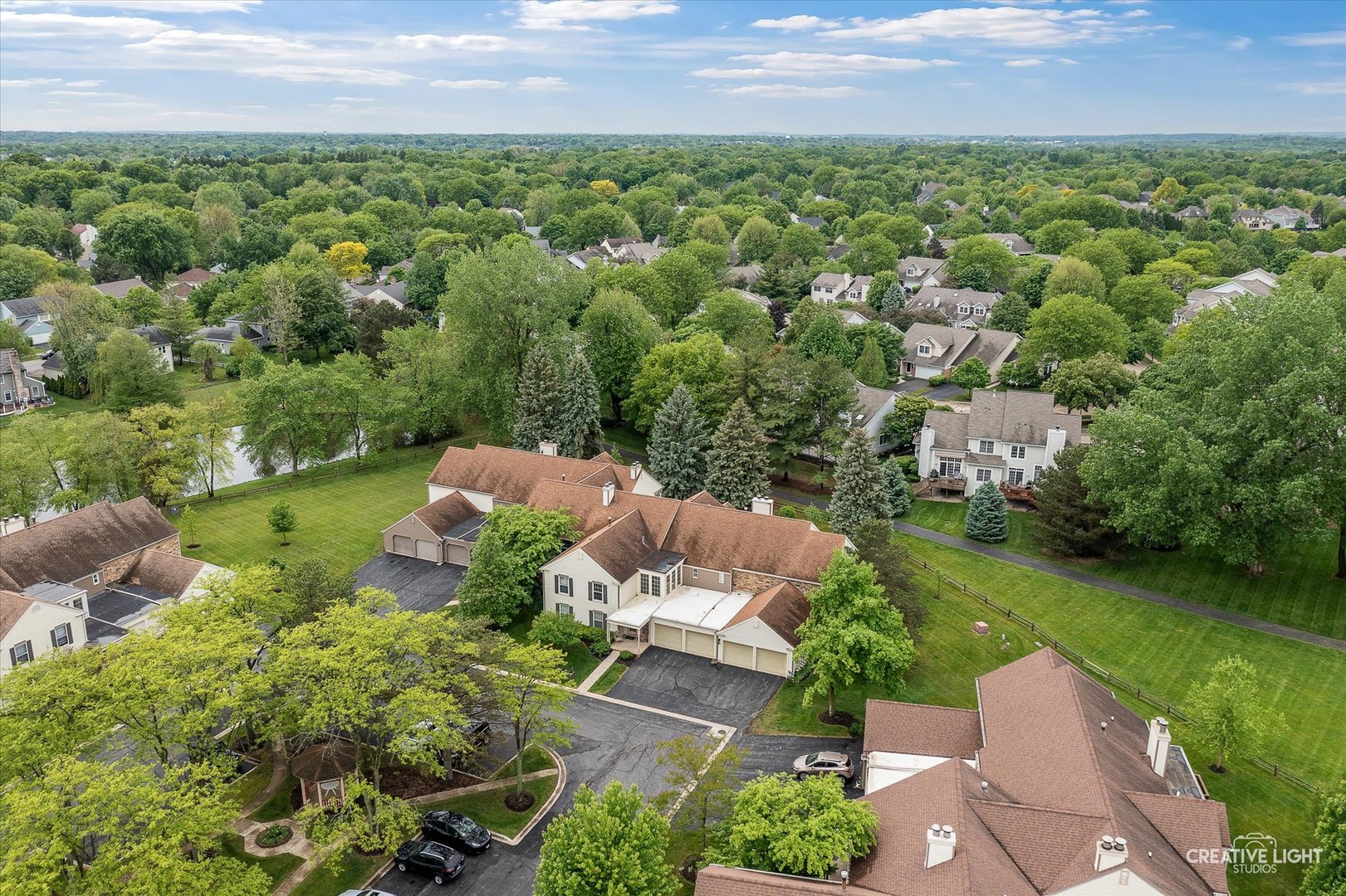 312 Dunham Place Commons, Unit 312 St. Charles, IL 60174 - Photo 28 of 28 an aerial view of residential houses with outdoor space and trees all around