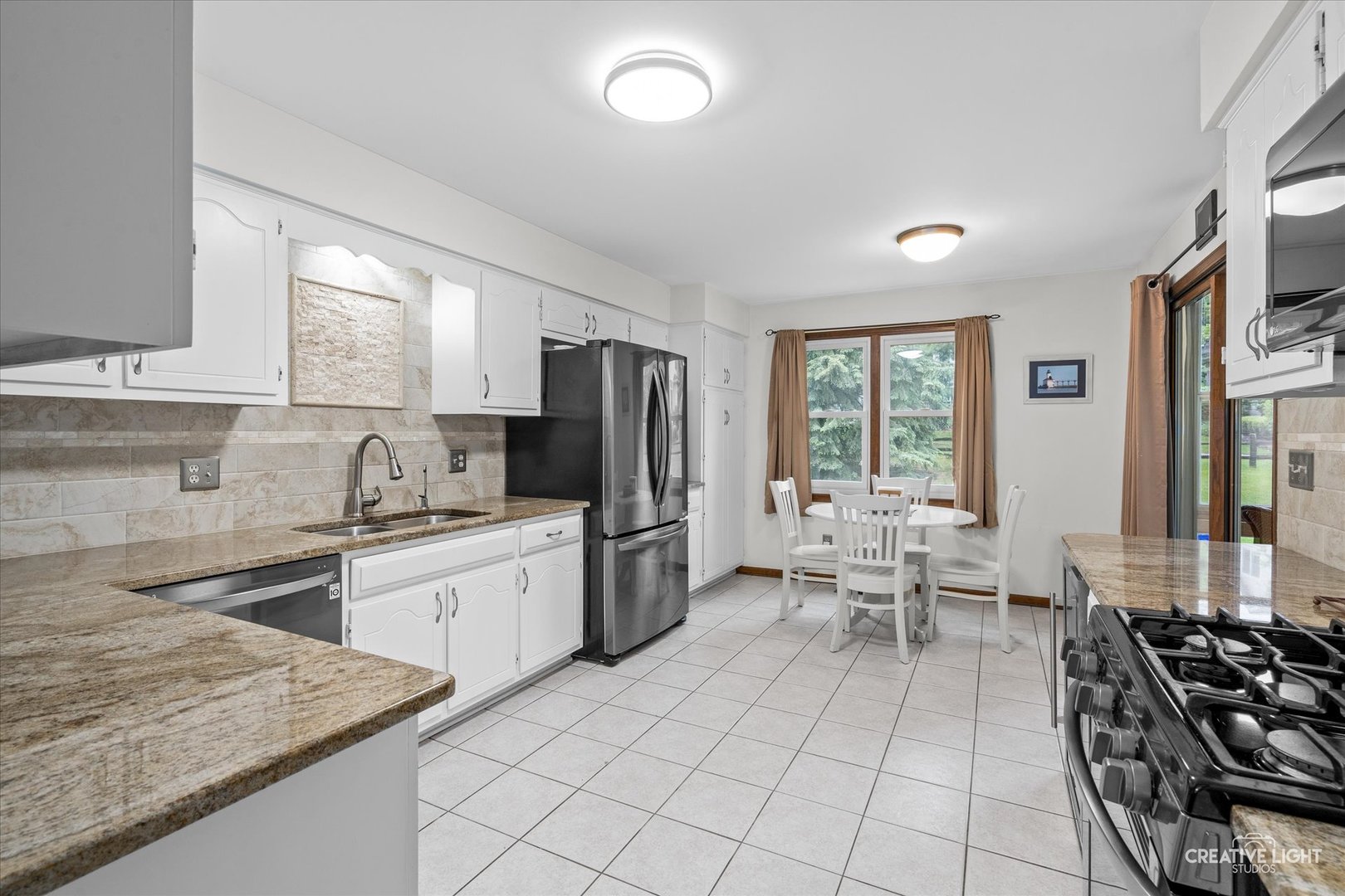 312 Dunham Place Commons, Unit 312 St. Charles, IL 60174 - Photo 3 of 28 a kitchen with sink cabinets and stainless steel appliances