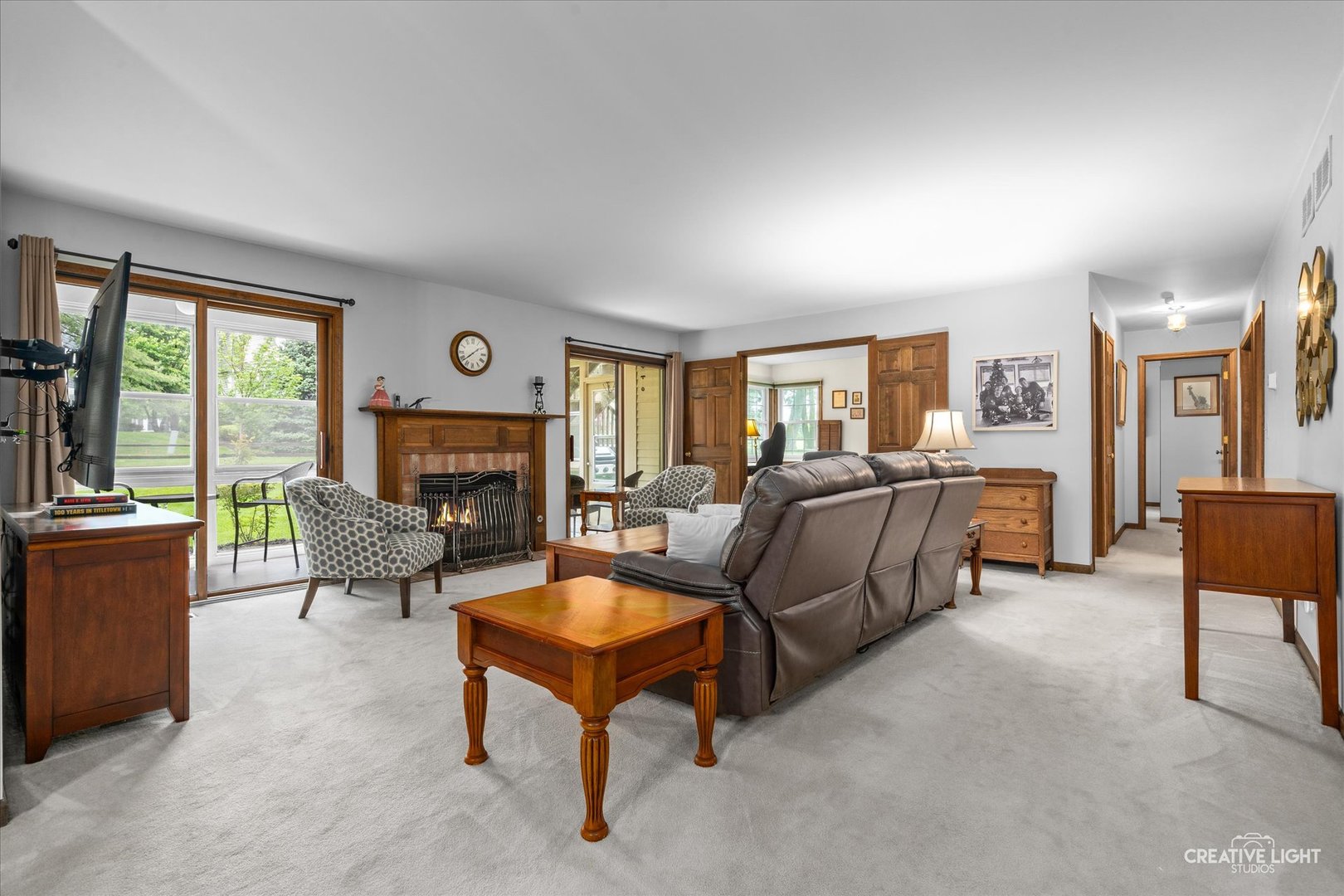 312 Dunham Place Commons, Unit 312 St. Charles, IL 60174 - Photo 8 of 28 a living room with furniture and a fireplace