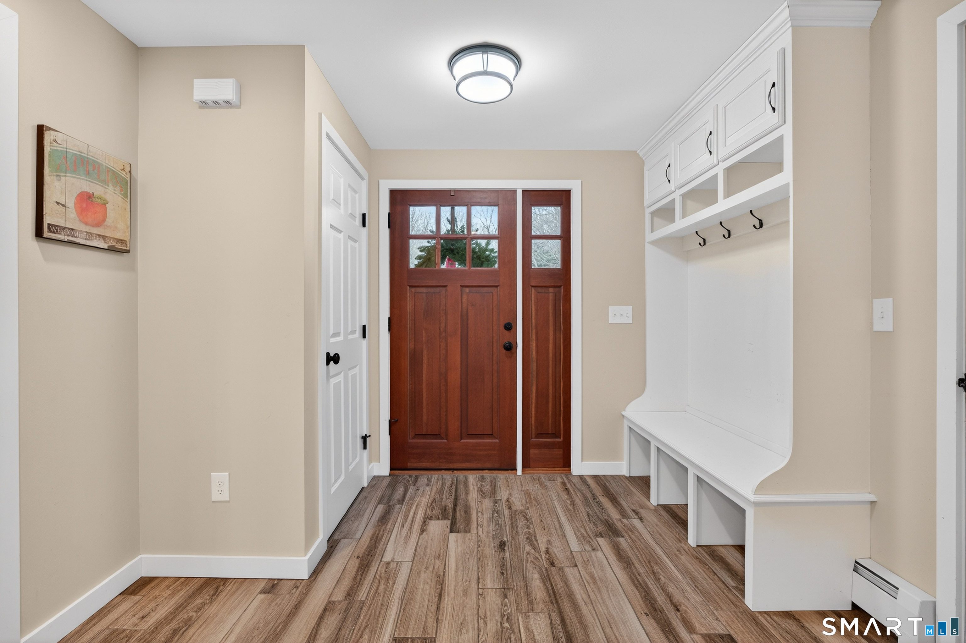 86 Hi-Lea Farm Road Colchester, CT 06415 - Photo 10 of 49 most used porch entryway cubby to the right the door to the garage is to the right half bath is to right as well the kitchen is to the left there is also a back door off of the mudroom.