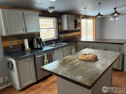 a kitchen with a stove and a sink